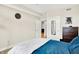 Stylish main bedroom features comfortable bedding and view to other rooms in home at 622 E 10Th St # 312, Indianapolis, IN 46202