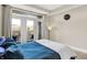 Charming main bedroom featuring balcony, natural light, and comfortable furnishings at 622 E 10Th St # 312, Indianapolis, IN 46202