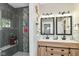 Beautiful bathroom features a shower and double vanity with modern finishes at 6301 Prospect St, Indianapolis, IN 46203
