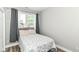Bedroom featuring hard surface floors, a window, and neutral walls at 6301 Prospect St, Indianapolis, IN 46203