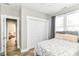 Well-lit bedroom featuring natural light, neutral walls, and a closet at 6301 Prospect St, Indianapolis, IN 46203