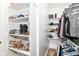 Walk-in closet featuring built-in shelving for ample storage and organization at 6301 Prospect St, Indianapolis, IN 46203
