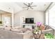 Inviting living room with comfortable seating, a ceiling fan, and a view of the adjacent dining room at 6301 Prospect St, Indianapolis, IN 46203
