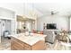 Open-concept living space with a kitchen island, dining area, and a cozy living room at 6301 Prospect St, Indianapolis, IN 46203