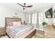 This main bedroom features a ceiling fan, natural light, and wood flooring at 6301 Prospect St, Indianapolis, IN 46203
