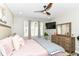 Spacious main bedroom with wood flooring, neutral walls, ceiling fan and natural light at 6301 Prospect St, Indianapolis, IN 46203