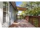 Inviting back deck features a canopy and wood railing overlooking the backyard at 6333 Pinebark Pl, Indianapolis, IN 46217
