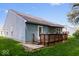 Back exterior of the home features a deck with ambient lighting and green lawn at 6333 Pinebark Pl, Indianapolis, IN 46217