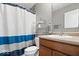 This bathroom has a vanity with a sink, a toilet and a shower with a curtain at 6333 Pinebark Pl, Indianapolis, IN 46217