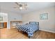 This bedroom has a ceiling fan, wood floors and a study desk area with a chair at 6333 Pinebark Pl, Indianapolis, IN 46217