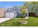 Charming single-story home featuring a two-car garage, manicured lawn, and inviting curb appeal at 6333 Pinebark Pl, Indianapolis, IN 46217