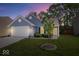 Charming single-story home featuring a well-manicured lawn, attached garage, and welcoming curb appeal at 6333 Pinebark Pl, Indianapolis, IN 46217