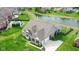 Stunning aerial view of the home, highlighting its spacious backyard and pond at 6784 W May Apple Dr, McCordsville, IN 46055
