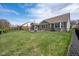 Beautiful brick home with spacious backyard, patio, sunroom, and landscaped gardens at 6784 W May Apple Dr, McCordsville, IN 46055