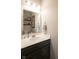 A powder room features a modern vanity with a stylish mirror and decor at 6784 W May Apple Dr, McCordsville, IN 46055