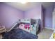 A playful bedroom features a bunk bed with slide and a cozy beanbag chair at 6784 W May Apple Dr, McCordsville, IN 46055