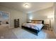 Cozy bedroom featuring a plush bed with floral bedding, carpeted floors, and natural light at 6784 W May Apple Dr, McCordsville, IN 46055