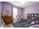 A charming bedroom with playful touches including a slide from the bunk bed at 6784 W May Apple Dr, McCordsville, IN 46055