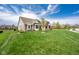 Well-maintained front yard showcasing lush green lawn, mature trees, and attractive landscaping enhancing curb appeal at 6784 W May Apple Dr, McCordsville, IN 46055