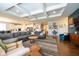 Expansive living room showcases an open-concept design, seamlessly connecting the kitchen and dining area at 6784 W May Apple Dr, McCordsville, IN 46055