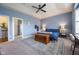 Large primary bedroom with an en suite bathroom, a bedroom set, and neutral carpeting at 6784 W May Apple Dr, McCordsville, IN 46055