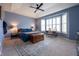 Spacious main bedroom with tray ceilings, neutral carpeting, and an abundance of natural light at 6784 W May Apple Dr, McCordsville, IN 46055