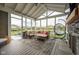 Spacious screened-in porch with a cozy seating area and fireplace at 6784 W May Apple Dr, McCordsville, IN 46055