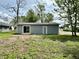 A detached garage with a sliding glass door and a separate access door in backyard at 692 S Crawford St, Martinsville, IN 46151
