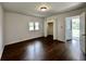 Inviting bedroom featuring hardwood floors, a closet, and a window for natural light at 692 S Crawford St, Martinsville, IN 46151