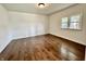 Bedroom featuring hardwood floors, neutral walls, natural lighting from the window and lots of space at 692 S Crawford St, Martinsville, IN 46151