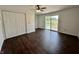 Bedroom with a closet, ceiling fan, and sliding doors to the backyard at 692 S Crawford St, Martinsville, IN 46151