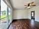 Bright bedroom featuring wood floors and a sliding glass door to the backyard at 692 S Crawford St, Martinsville, IN 46151