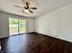 Bedroom featuring a ceiling fan and access to the backyard through sliding doors at 692 S Crawford St, Martinsville, IN 46151