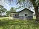 Charming home featuring gray siding, brick foundation, and covered front porch at 692 S Crawford St, Martinsville, IN 46151