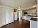 Charming kitchen with gray cabinets, white appliances, and hardwood floors at 692 S Crawford St, Martinsville, IN 46151