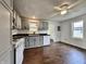 Charming kitchen with gray cabinets, white appliances, and hardwood floors at 692 S Crawford St, Martinsville, IN 46151