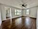 Bright living room featuring hardwood floors, neutral walls, ceiling fan and plenty of natural light at 692 S Crawford St, Martinsville, IN 46151