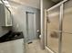 Well-lit bathroom featuring a sleek vanity and a walk-in shower with glass doors at 741 Springmill Dr, Mooresville, IN 46158