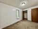 Simple bedroom with white walls, carpet floors, and built-in closet space at 741 Springmill Dr, Mooresville, IN 46158