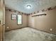 Neutral bedroom featuring carpet, beige walls, and a window with natural light at 741 Springmill Dr, Mooresville, IN 46158