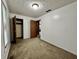 Bright bedroom with wainscotting, light fixture, closet, window and neutral-toned carpet at 741 Springmill Dr, Mooresville, IN 46158