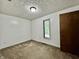 Bright bedroom with wainscotting, light fixture, closet, window and neutral-toned carpet at 741 Springmill Dr, Mooresville, IN 46158