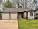 Charming single-story home featuring a two-car garage and a well-manicured lawn at 741 Springmill Dr, Mooresville, IN 46158