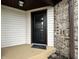 Close-up of a front door with glass pane and white sidelight at 741 Springmill Dr, Mooresville, IN 46158