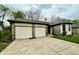 Charming home exterior showcasing a two-car garage and well-maintained front yard at 741 Springmill Dr, Mooresville, IN 46158