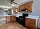 Well-lit kitchen features wood cabinets, a double sink, white countertops, and modern appliances at 741 Springmill Dr, Mooresville, IN 46158