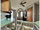 Close-up of a stainless steel sink and faucet in a kitchen setting at 741 Springmill Dr, Mooresville, IN 46158