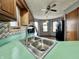 Kitchen featuring a breakfast bar with a stainless steel sink and faucet at 741 Springmill Dr, Mooresville, IN 46158