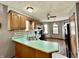 Kitchen featuring a breakfast bar, lots of windows, and wood cabinets at 741 Springmill Dr, Mooresville, IN 46158