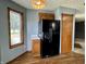 View of the kitchen features modern appliances, wood cabinets, and natural light from the window at 741 Springmill Dr, Mooresville, IN 46158